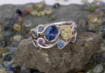 A Montana Sapphire bridal set with flowing bezels.